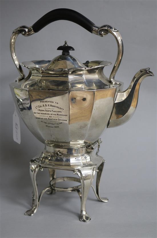 An Edwardian silver tea kettle on stand, with engraved military related inscription, Sibray, Hall & Co, London, 1908, gross 46.1 oz.